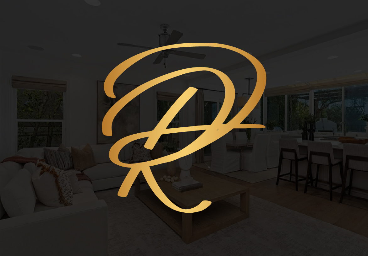 Golden 'DR' monogram logo for Deborah Robinson luxury real estate, elegantly placed over a blurred background of a high-end interior living space.