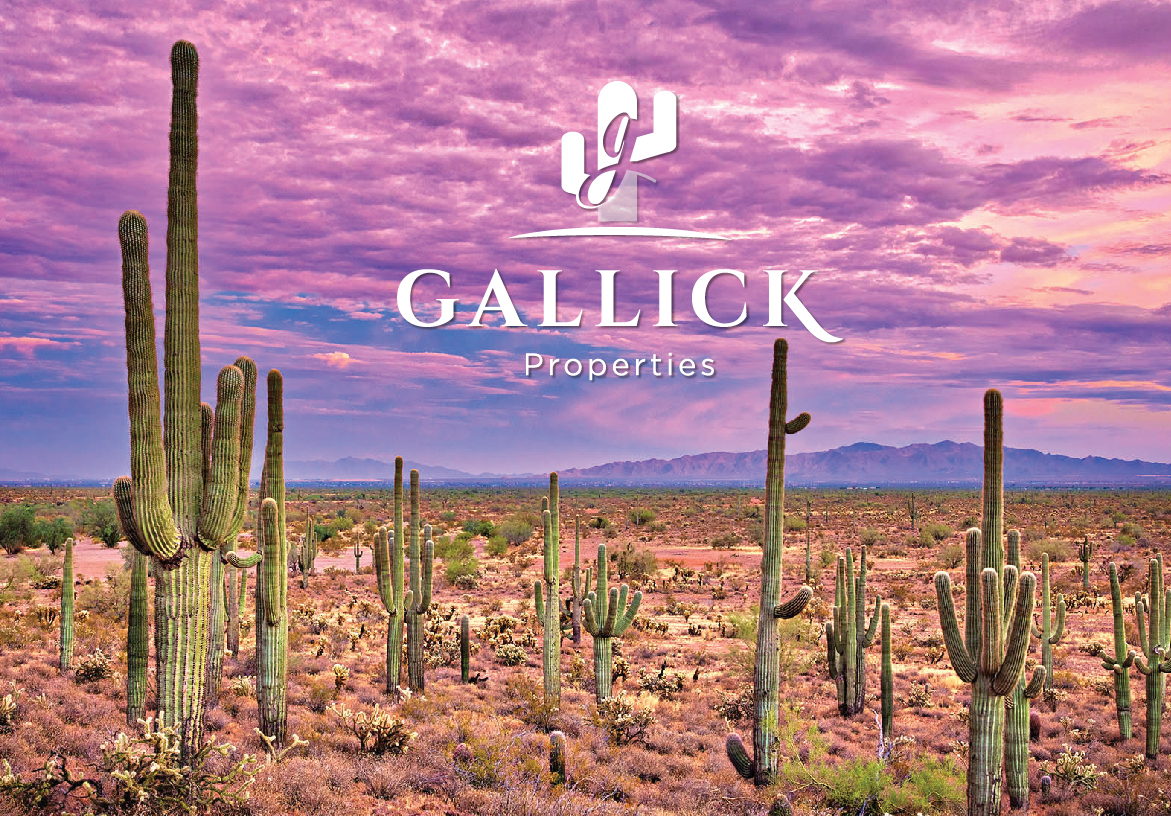 Gallick Properties logo in white, set against a stunning purple and pink Arizona desert sunset featuring towering saguaro cacti.