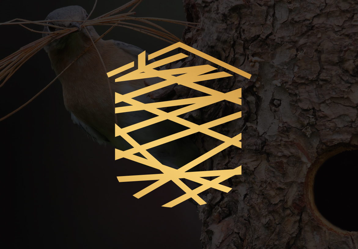 Gold icon for Humble Nest Group forming the shape of a house using stylized twigs, overlaid on a dark textured tree trunk background.