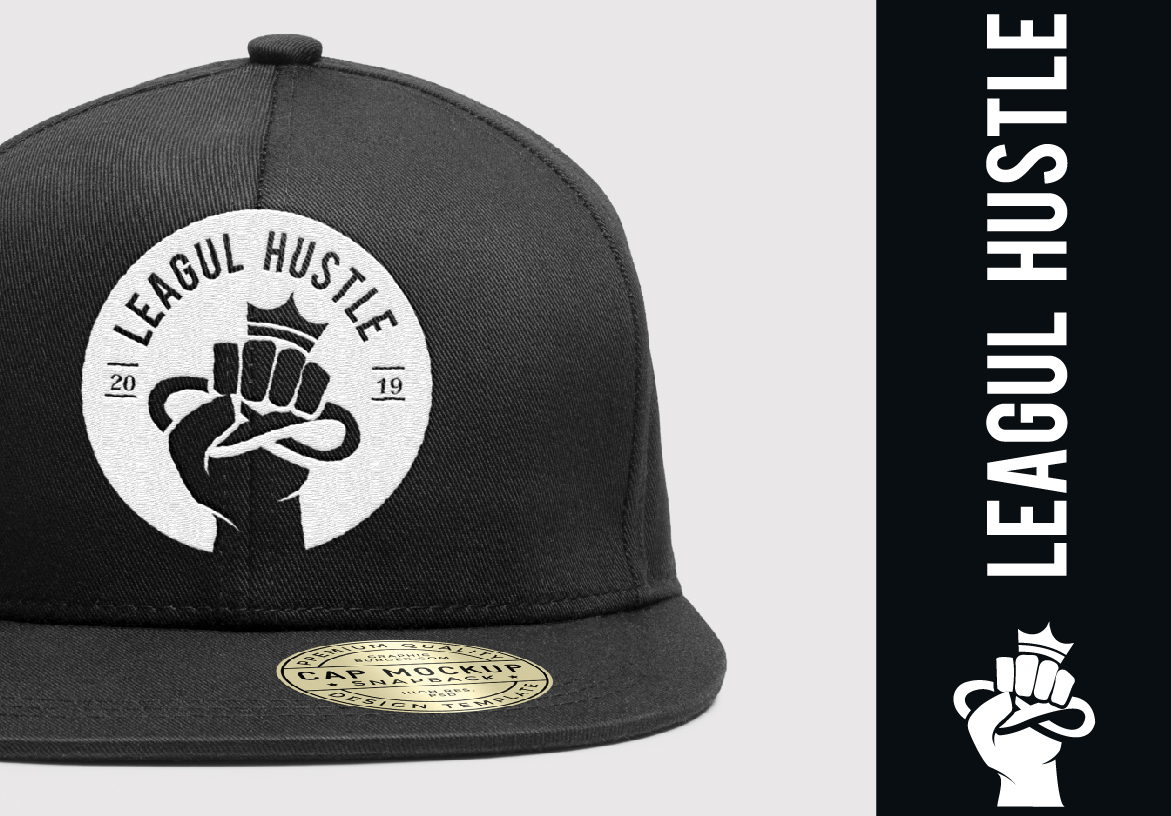 Black Leagul Hustle cap with a circular patch logo, displayed next to vertical typography branding for the Phoenix-based apparel line.