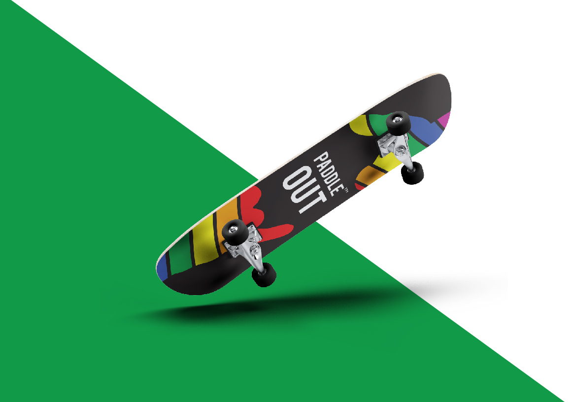 Paddle Out lifestyle branding applied to a skateboard, highlighting the connection between surf and skate culture on a green background.