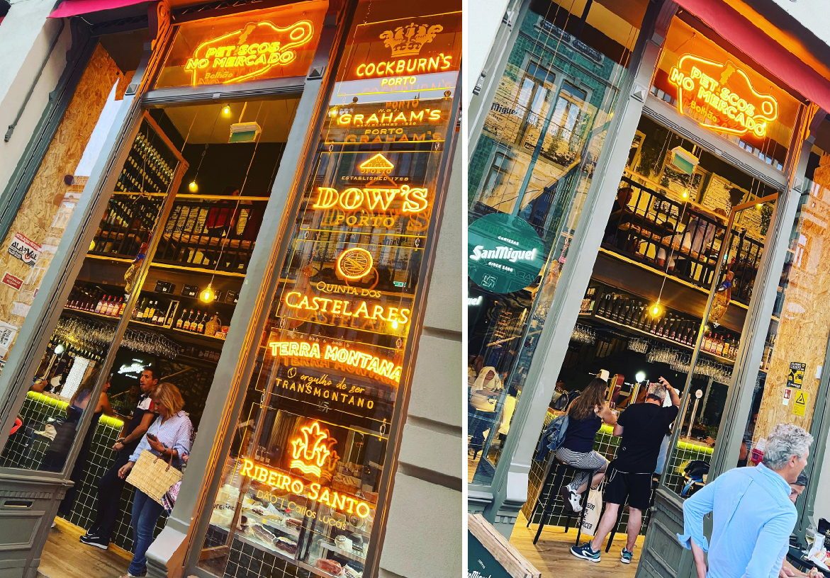 Glass storefront of Petiscos no Mercado featuring gold lettering branding and a list of premium Port wines like Graham's and Dow's.