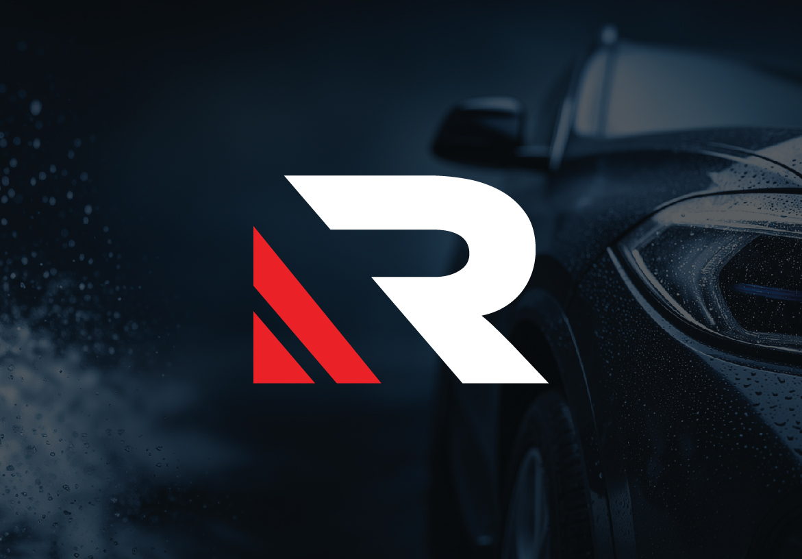 Stylized 'R' logo symbol for Refinatto Auto Detail & Barbershop, featuring a sleek, speed-inspired design set against a dark premium automotive background.