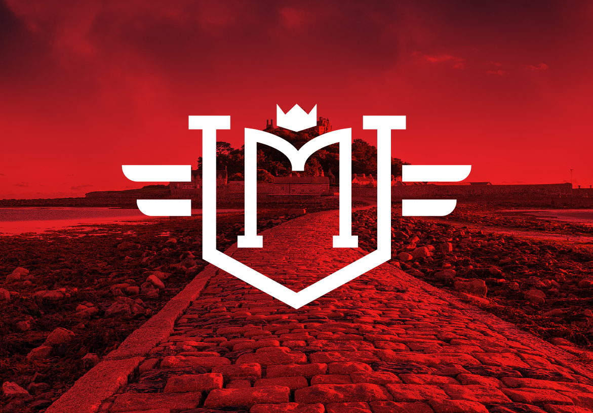 Bold red St. Michael's Ventures logo, featuring a shield with an 'MV' monogram and wings, set against a dramatic red-hued landscape with a stone path.