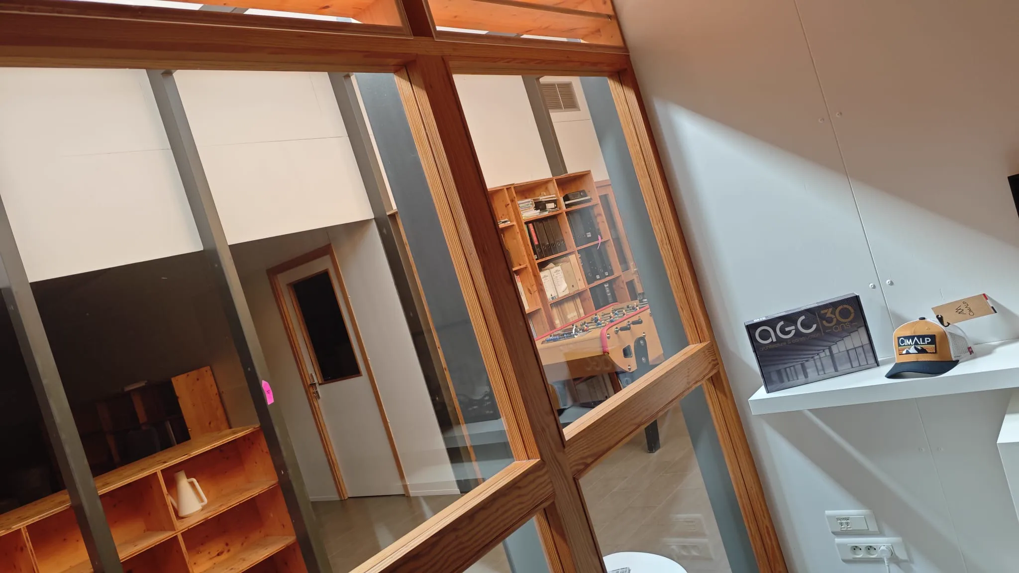 AGC office detail with a 30 years presentation box displayed on a shelf