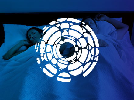 White Apnea Today logo icon, resembling stylized airway cells, overlaid on a blue night-time photo of a woman sleeping peacefully.