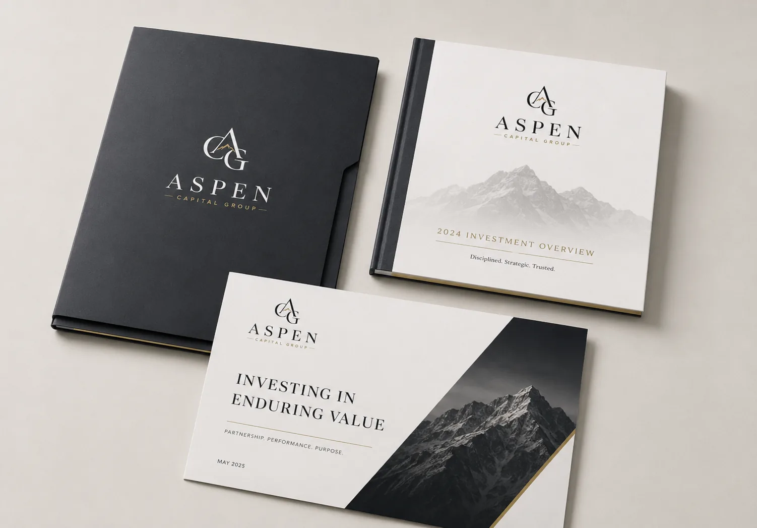 Aspen Capital Group hardcover brand books featuring a mountain cover and serif wordmark