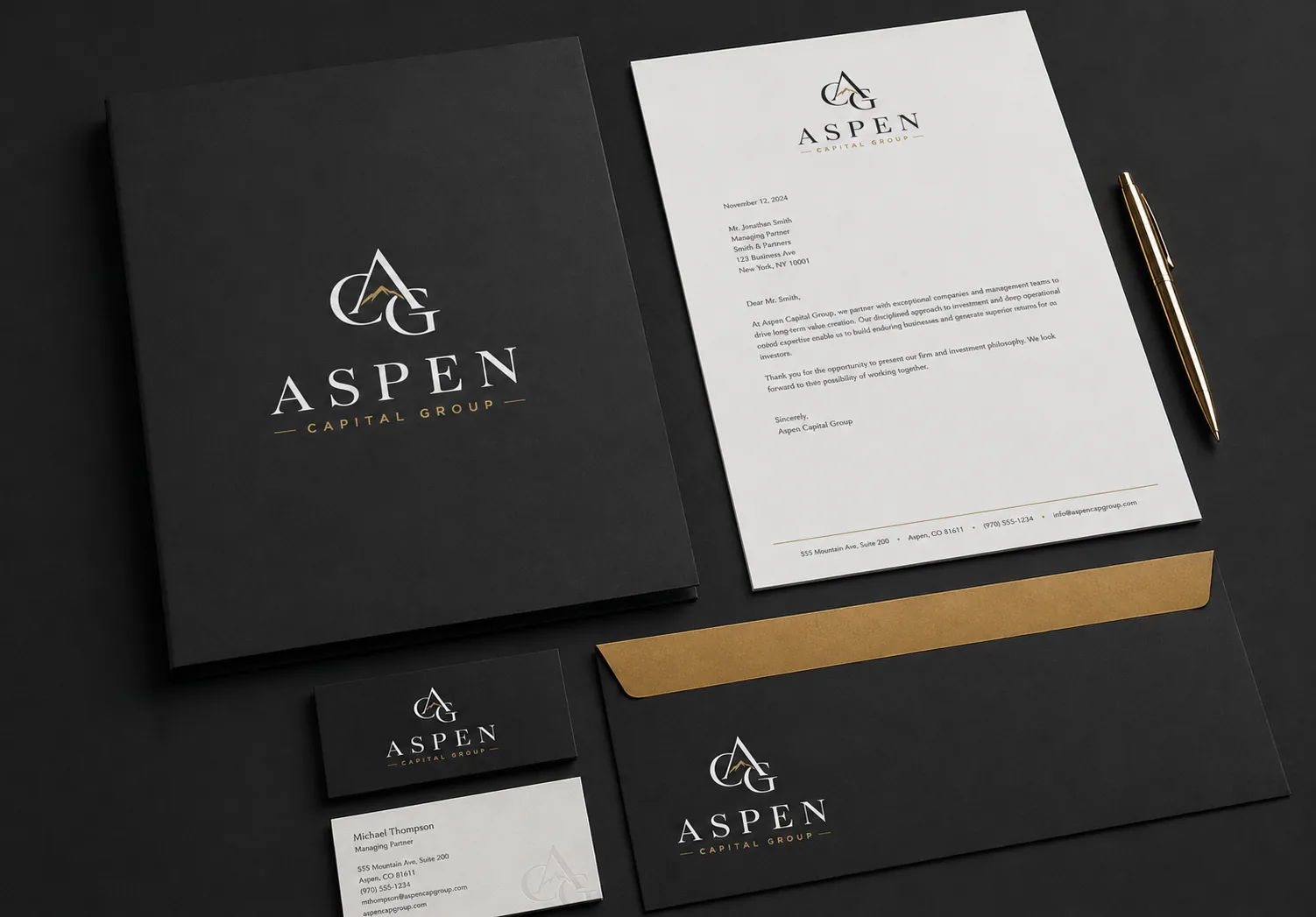 Aspen Capital Group dark stationery flatlay with folder, letterhead, business cards, and gold envelope