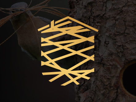 Gold icon for Humble Nest Group forming the shape of a house using stylized twigs, overlaid on a dark textured tree trunk background.