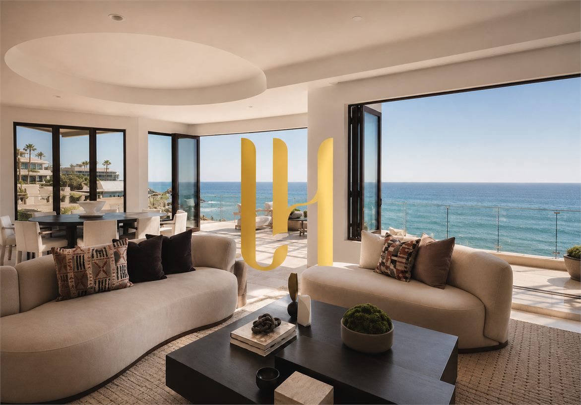 Lauren Halcovich LH monogram displayed inside an oceanfront living room with panoramic coastal views