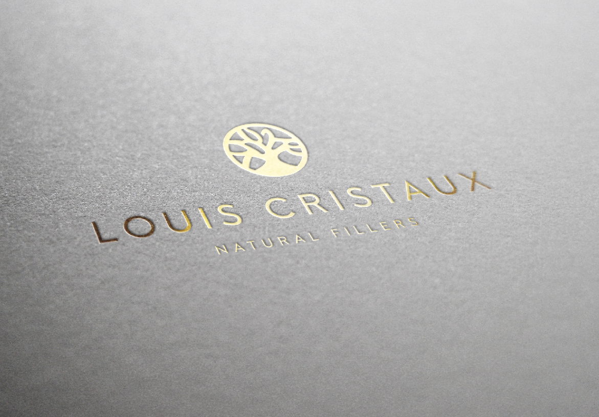 Louis Cristaux gold foil embossed logo on textured paper with luxury finishing detail