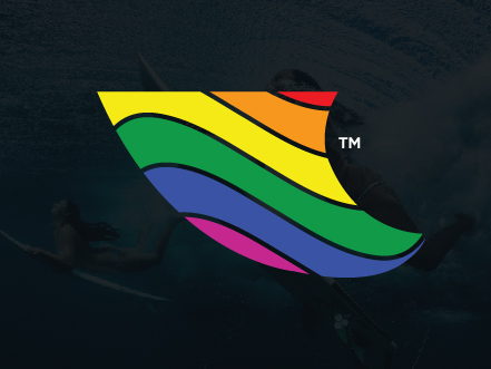 Paddle Out surf brand logo featuring a shark fin shape with vibrant rainbow stripes, overlaid on a dark ocean background.