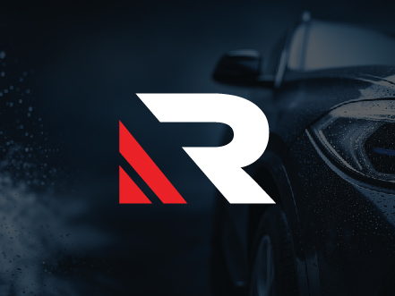 Stylized 'R' logo symbol for Refinatto Auto Detail & Barbershop, featuring a sleek, speed-inspired design set against a dark premium automotive background.