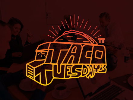 Taco Tuesday's Roadshow logo featuring a retro neon-style design in orange and yellow, set against a dark background to pop like a diner sign.