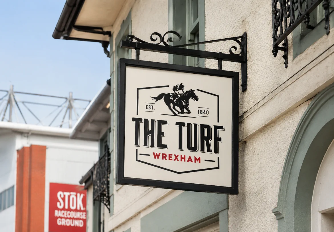 The Turf Wrexham pub sign with the horse and jockey logo outside the historic pub near the Racecourse Ground