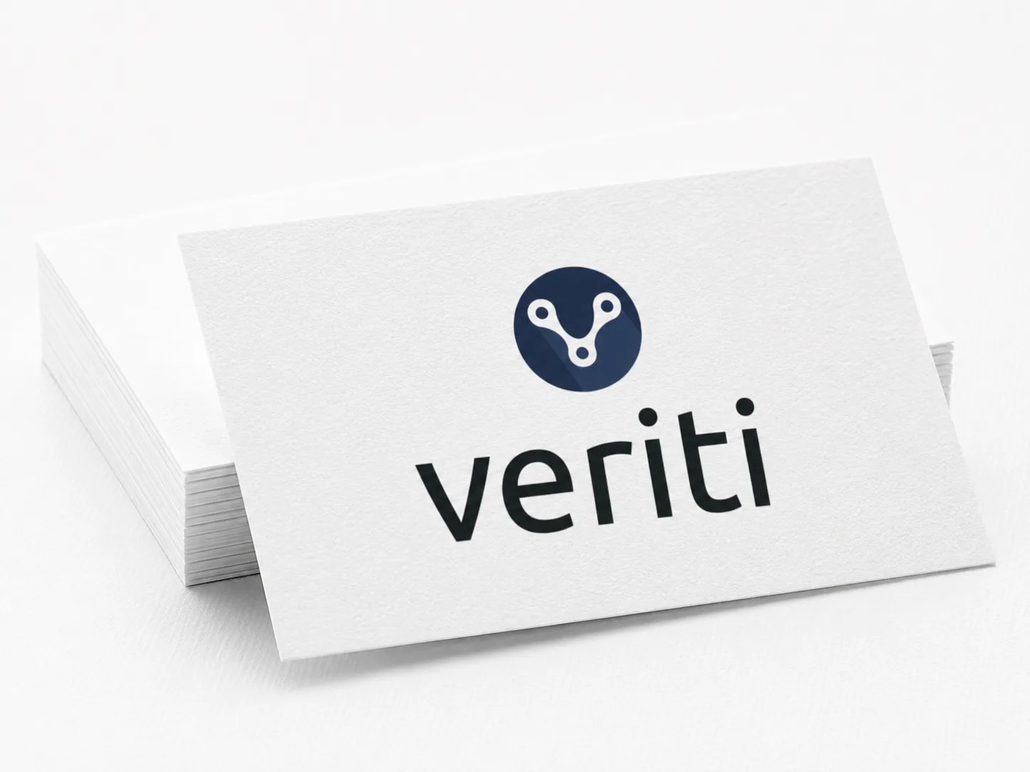 Veriti logo on a clean business card stack