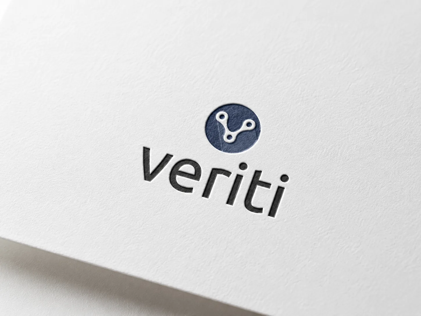 Veriti logo printed on textured white paper close up