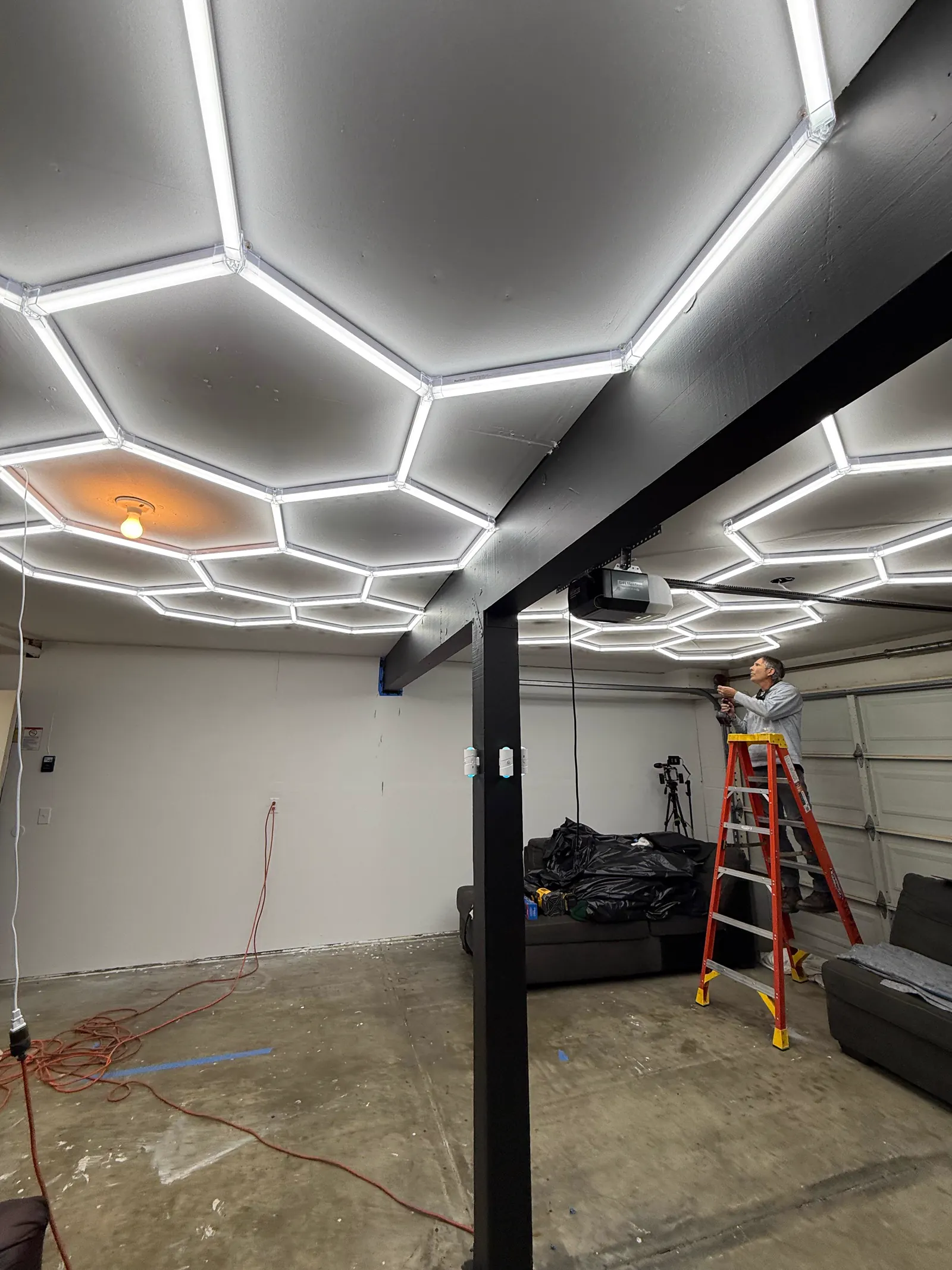 Close-up of hexagonal ceiling lights in the Wake Up Sports studio